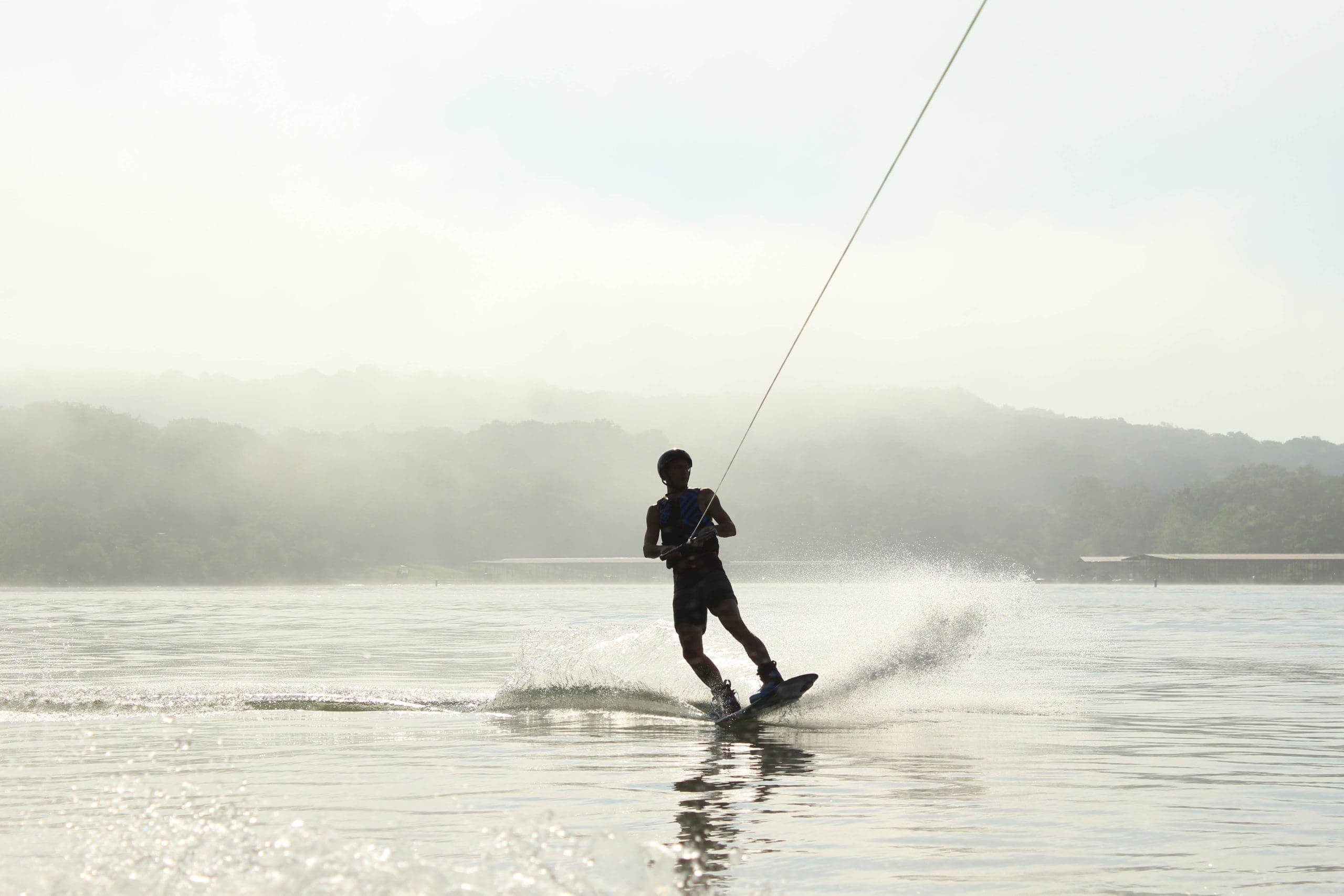 A man wakeboarding on water.