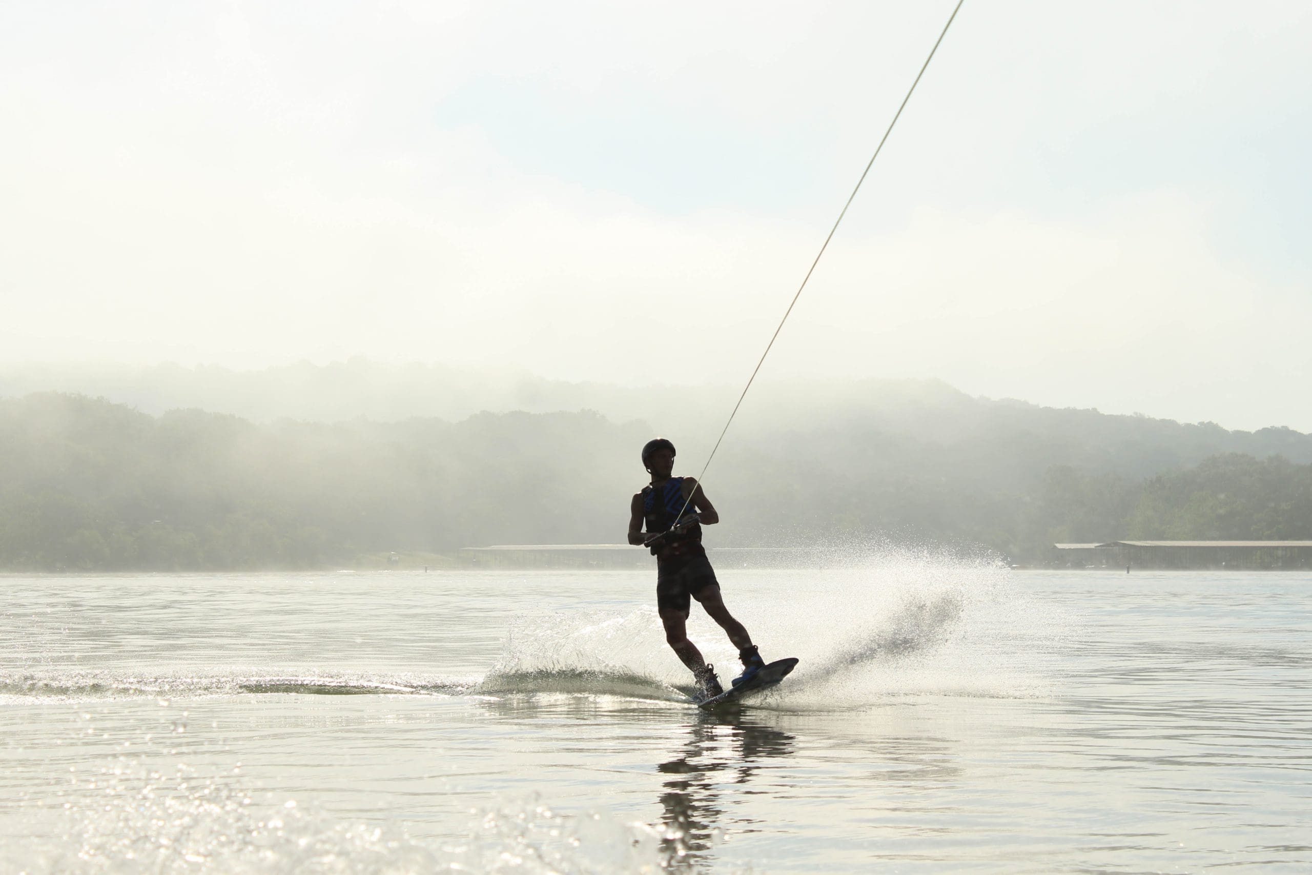 Wakboarding-unsplash A man wakeboarding on water.